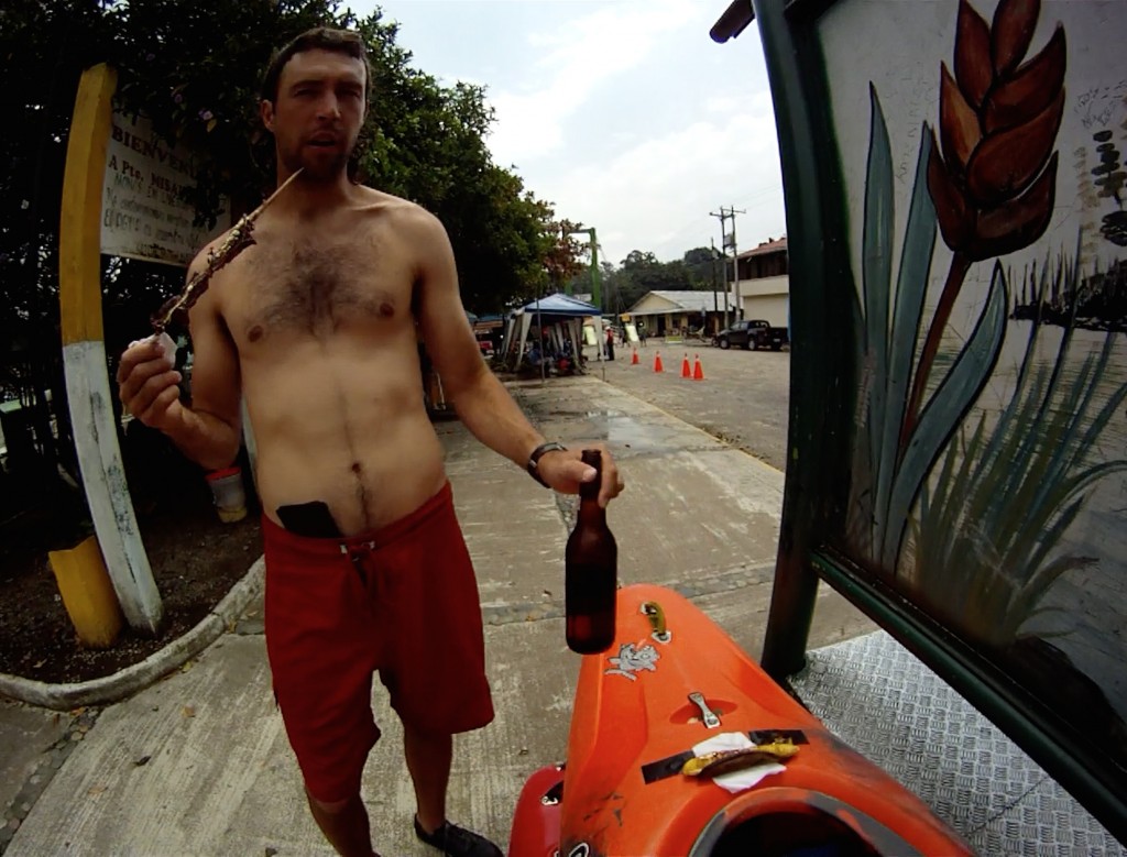 Colin with some take out snacks, Streetmeat, fried plantain and a Pilsner Beer