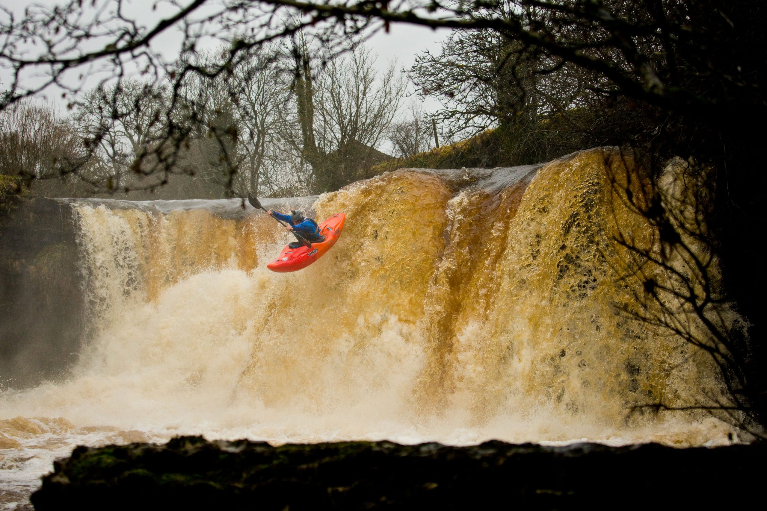 Bren Orton paddling a Scorch Large in Orange Soda